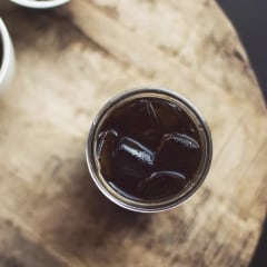 Cold brew over ice in a glass, seen from above