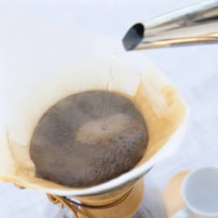 Coffee dripping through a paper filter